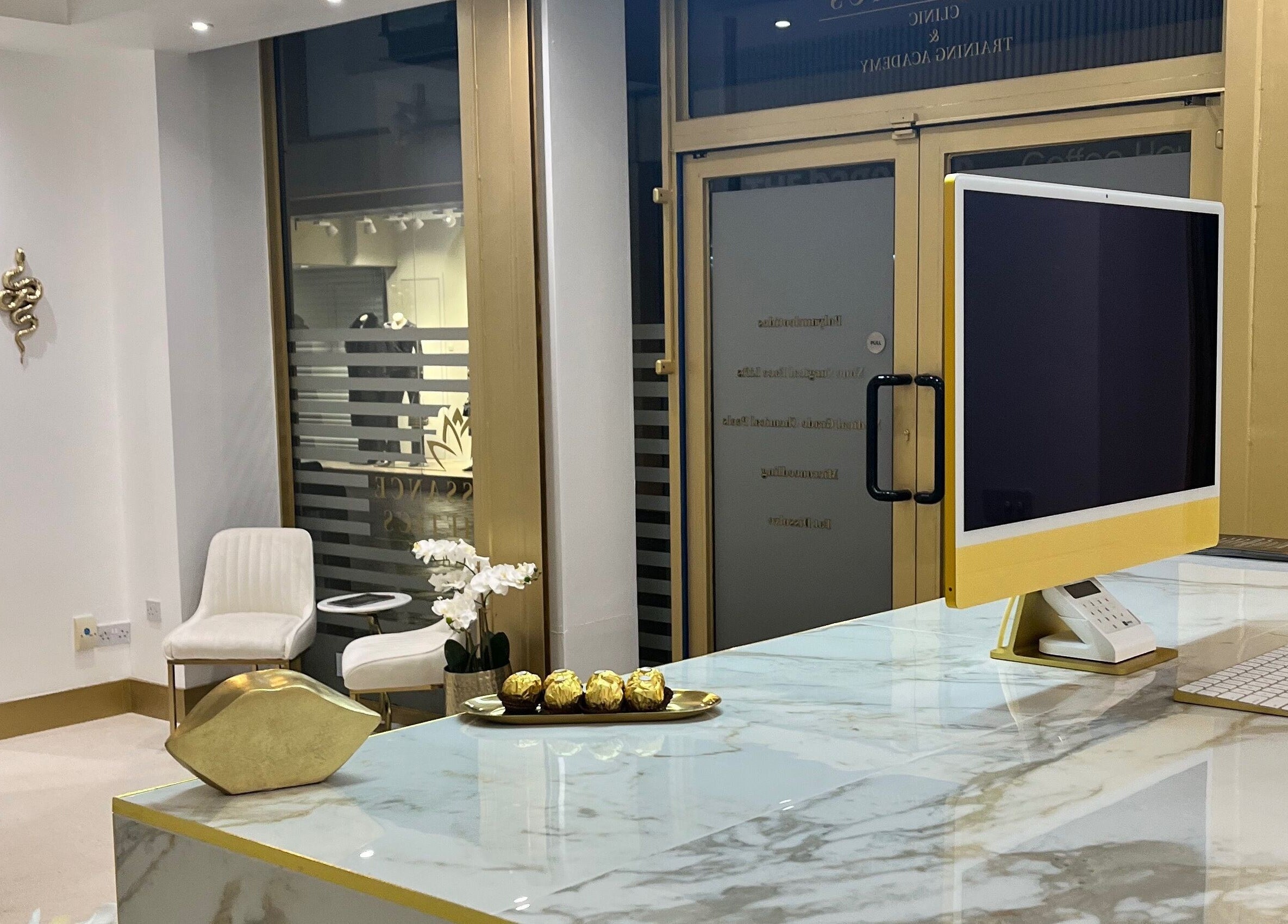 Chic reception at Renaissance Aesthetics, Sligo, County Sligo, IE featuring marble and gold accents.