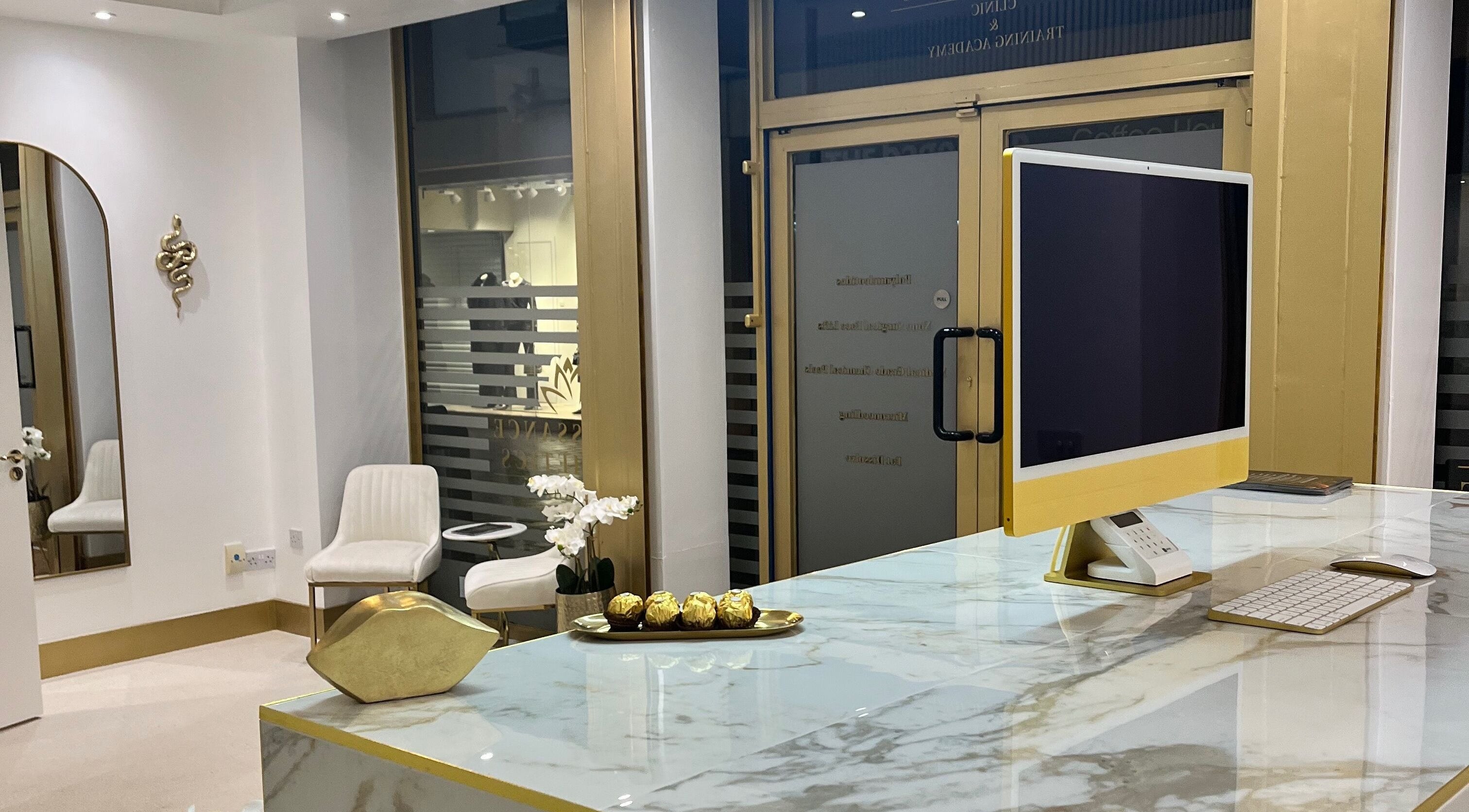 Chic reception at Renaissance Aesthetics, Sligo, County Sligo, IE featuring marble and gold accents.