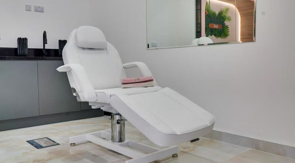 Modern treatment chair at K Brand Aesthetics, London, England, GB. Clean, inviting wellness environment.