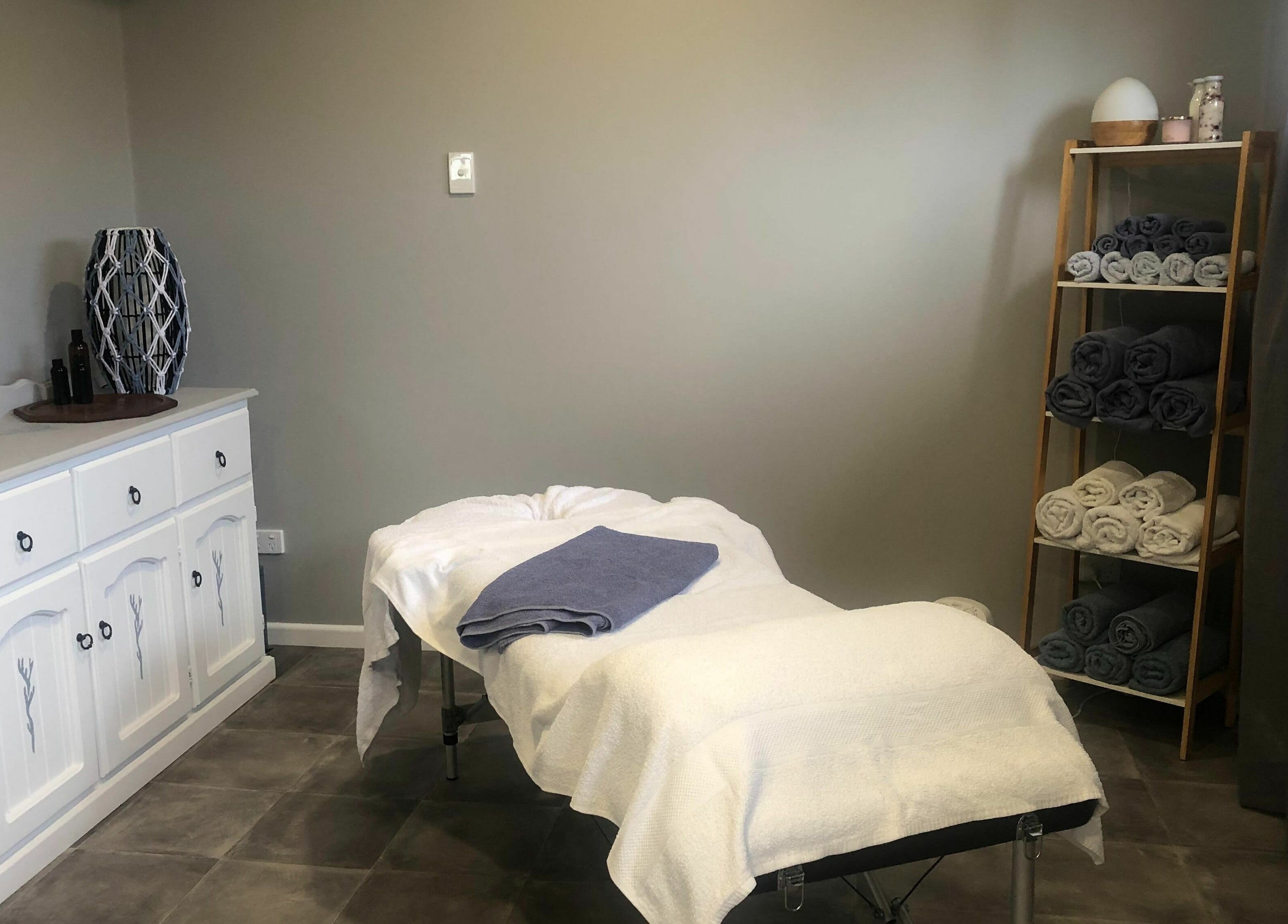 Relaxing massage room at Kays Remedial Massage Therapy, Barrack Heights, New South Wales, AU, with arranged towels.