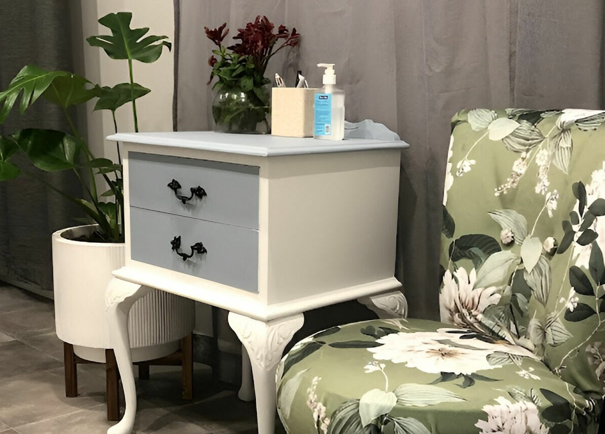 Floral chair and plant beside a chic table at Kays Remedial Massage Therapy, Barrack Heights, New South Wales, AU.