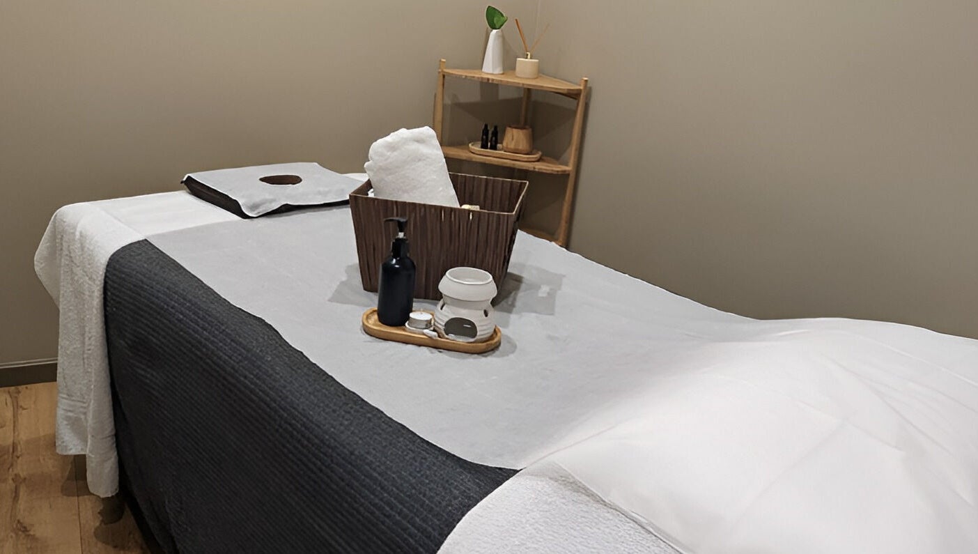 Serenity Cammeray Lux Spa massage room with oils and towels, Cammeray, New South Wales, AU.