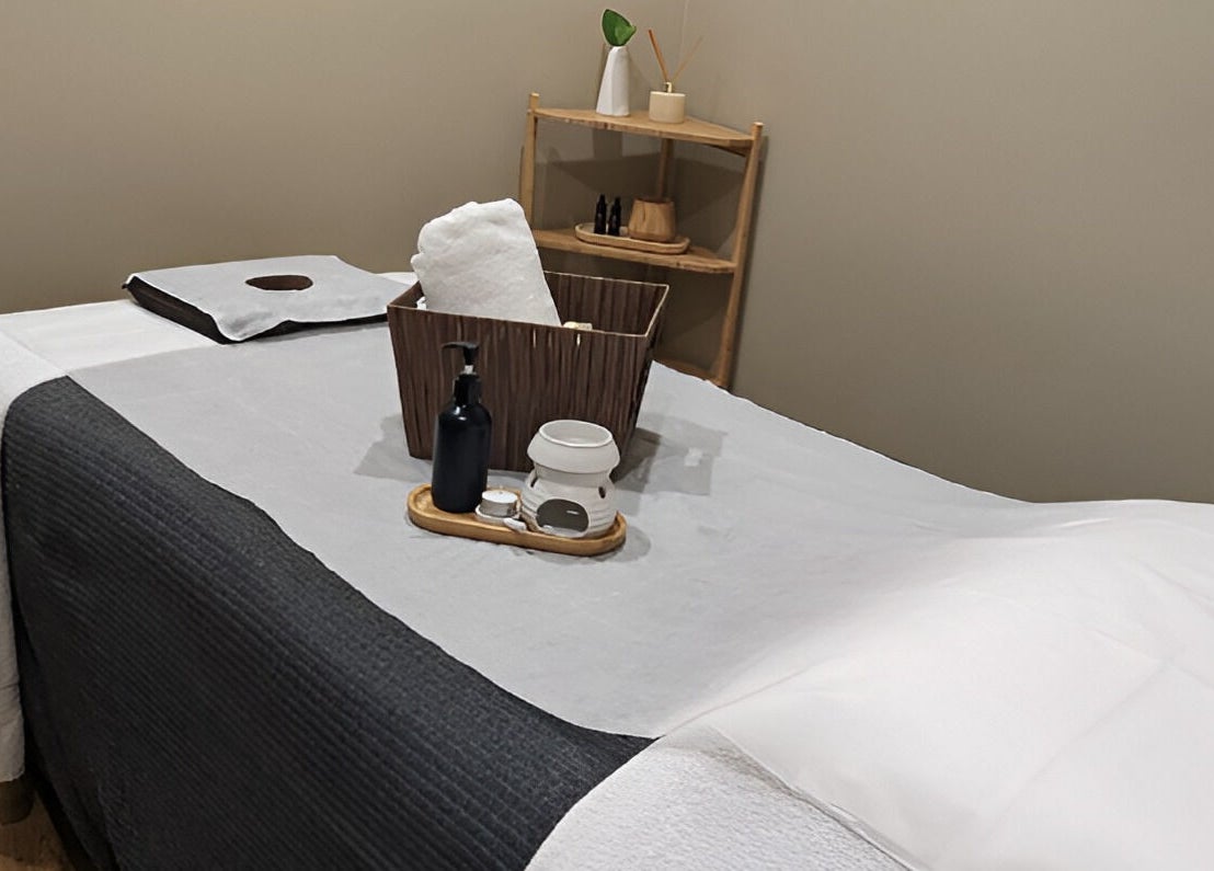 Serenity Cammeray Lux Spa massage room with oils and towels, Cammeray, New South Wales, AU.