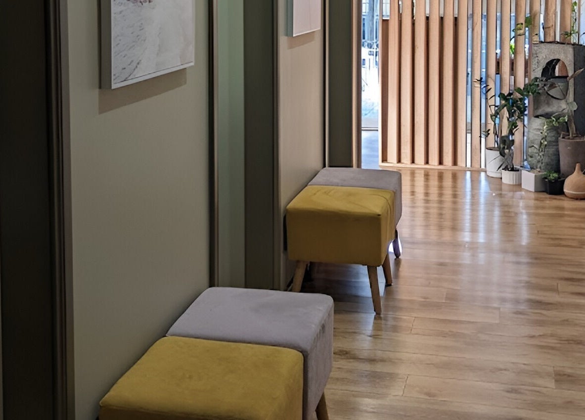 Serenity Cammeray Lux Spa's inviting hallway in Cammeray, New South Wales, AU, with plush seating and modern decor.