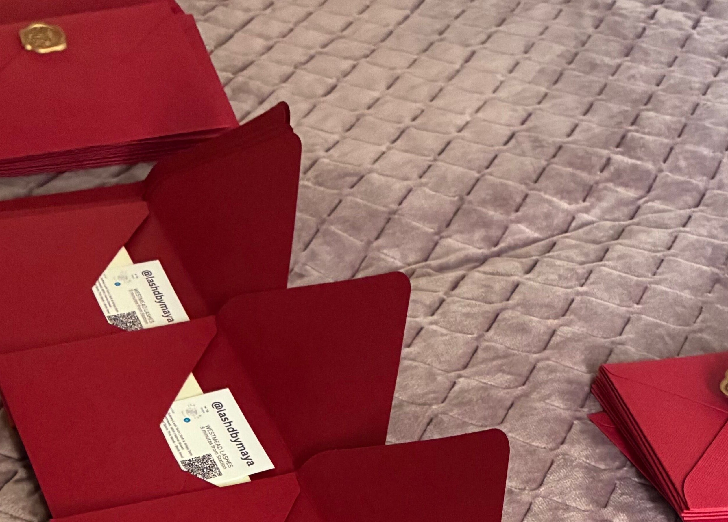 Red envelopes with wax seals at Lashed By Maya in Westmead, New South Wales, AU.