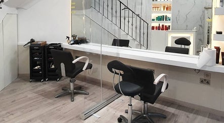 Modern styling chairs at Leonards Hair in Tas-Sliema, MT, showcasing a chic and welcoming salon environment.