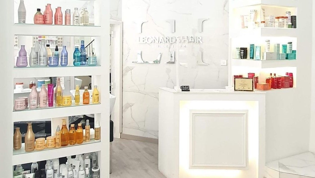 Elegant interior of Leonard's Hair in Tas-Sliema, MT showcasing premium hair care products.