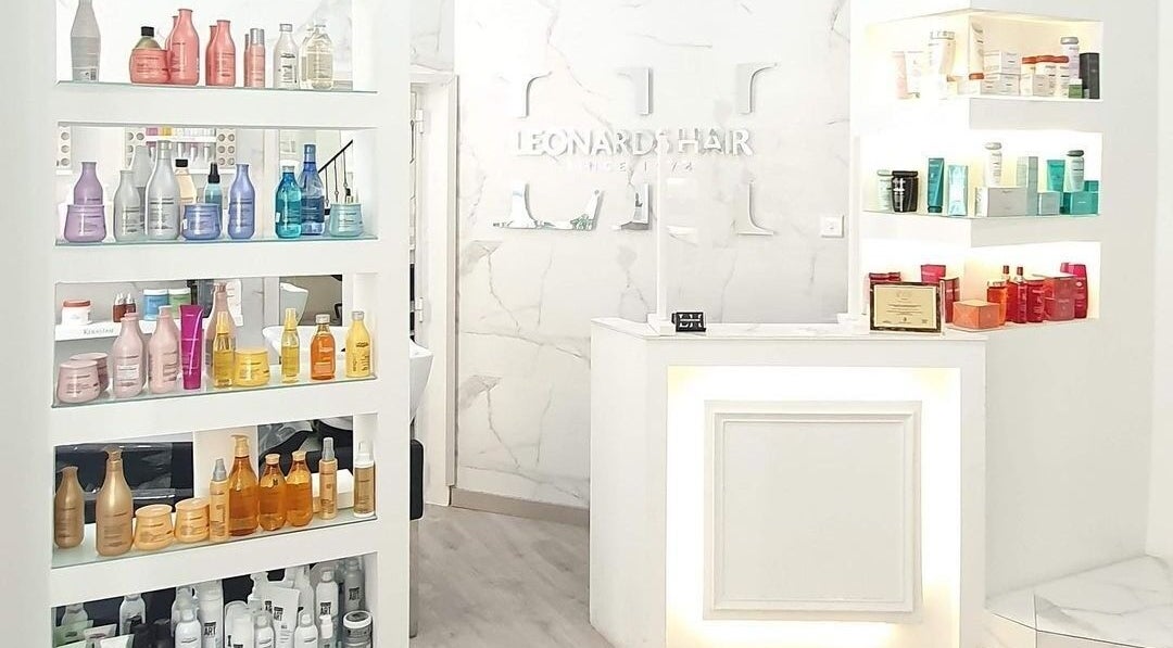 Elegant interior of Leonard's Hair in Tas-Sliema, MT showcasing premium hair care products.