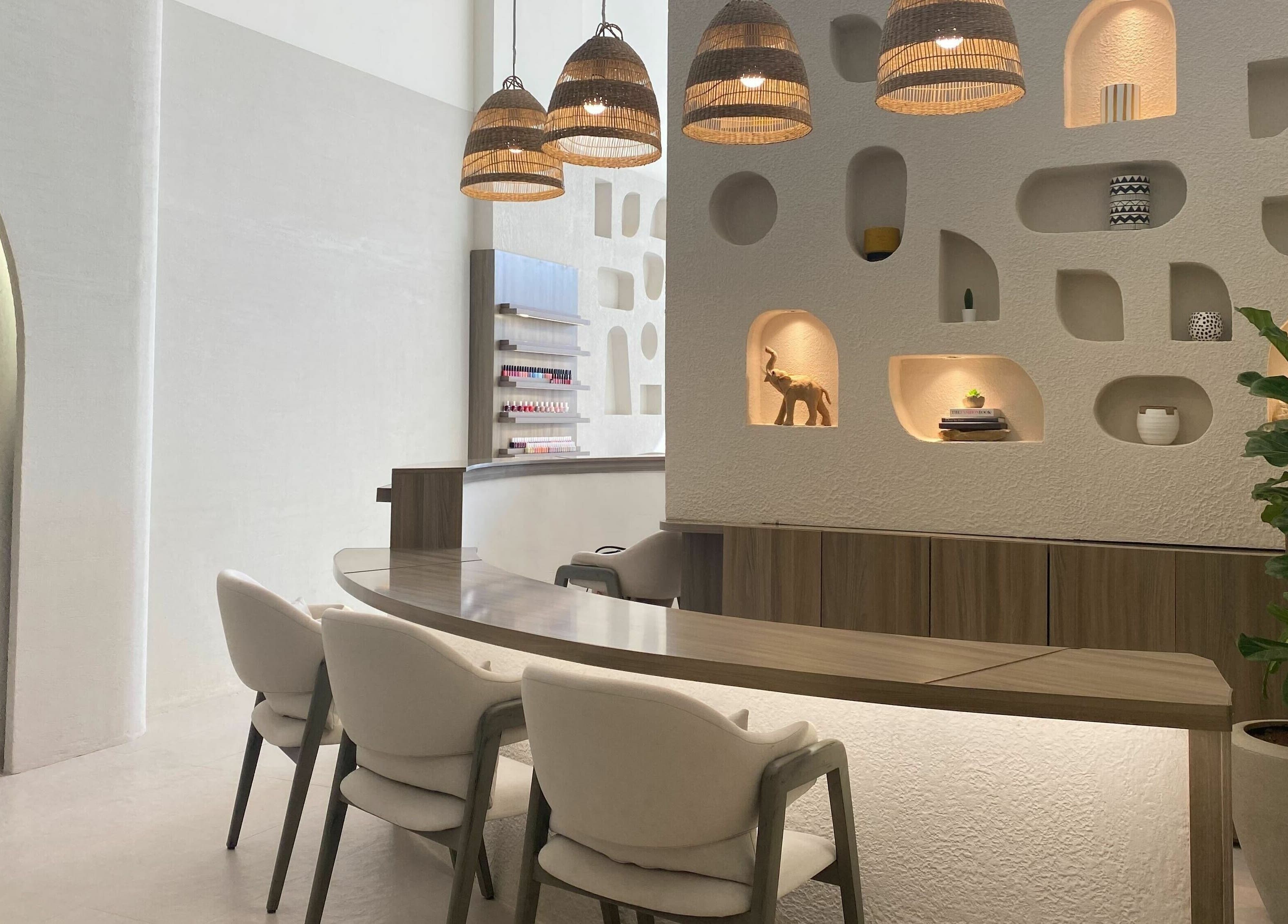 Modern interior of Kioko Nail Spa, Riyadh. Chic decor with wooden accents and cozy seating.