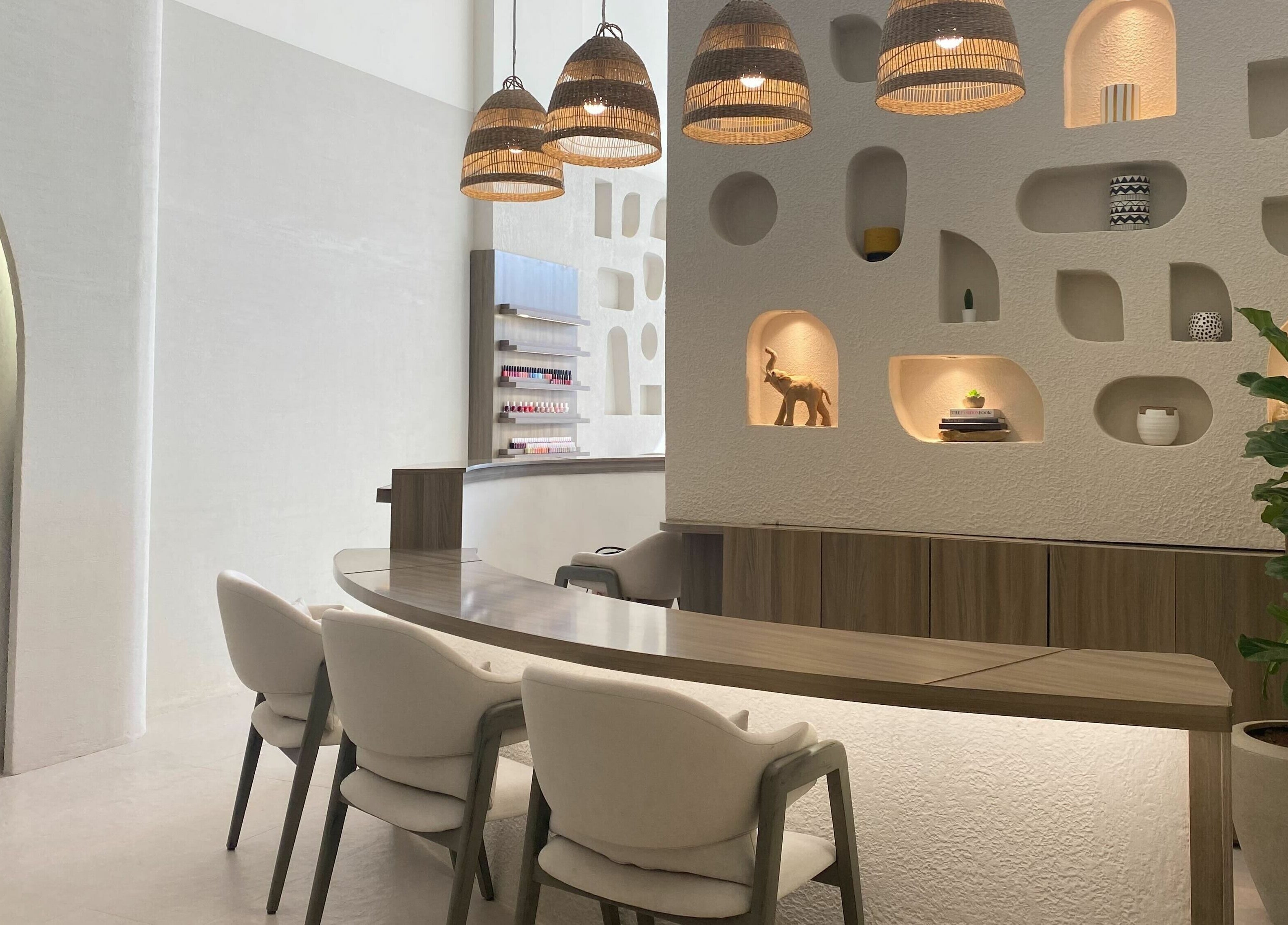 Modern interior of Kioko Nail Spa, Riyadh. Chic decor with wooden accents and cozy seating.
