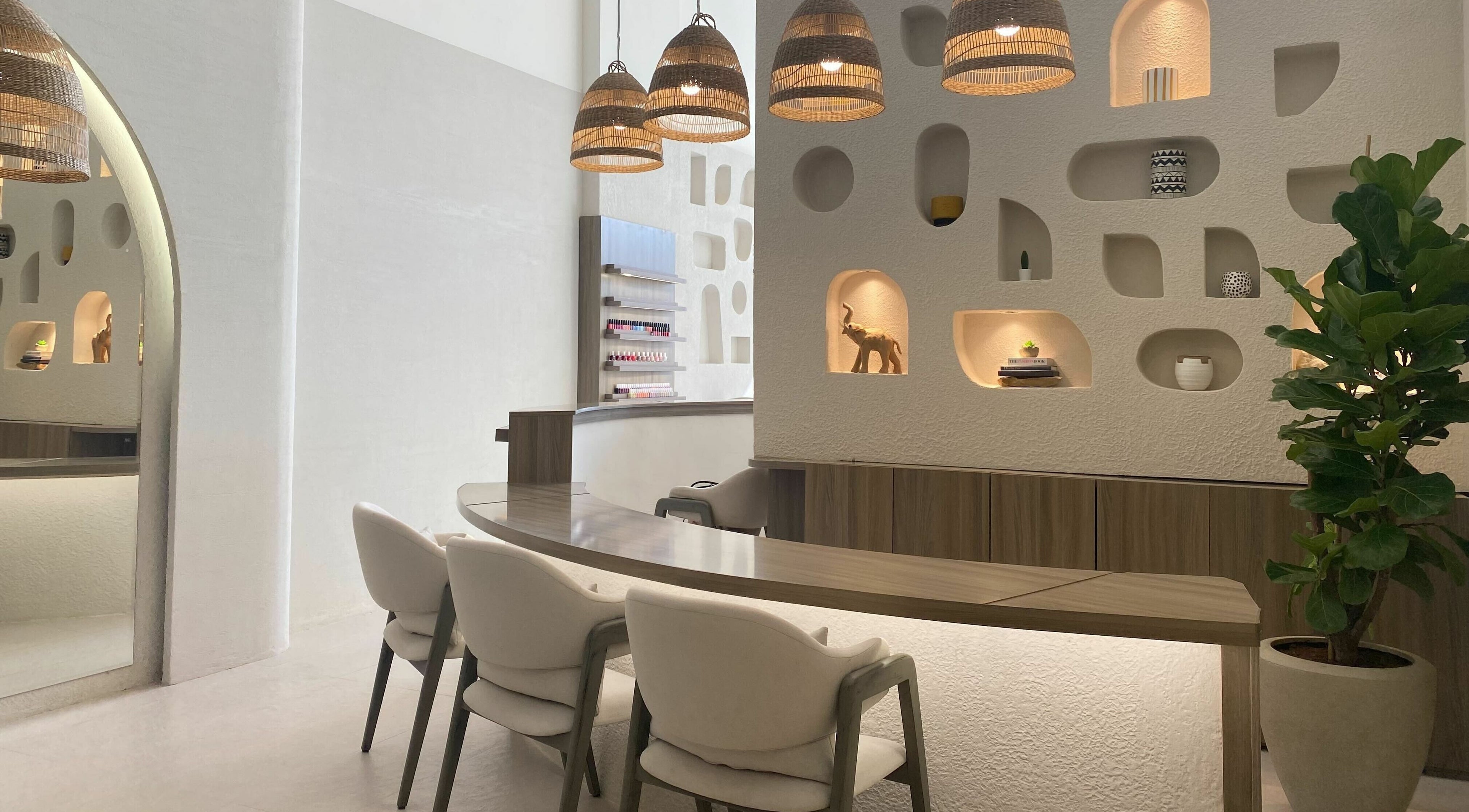 Modern interior of Kioko Nail Spa, Riyadh. Chic decor with wooden accents and cozy seating.