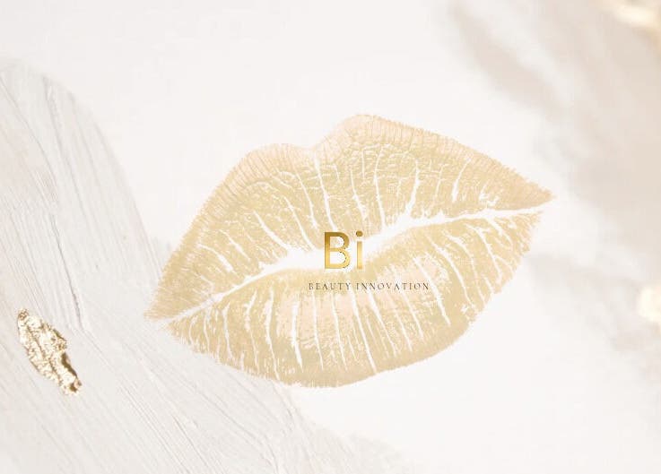 Elegant golden lip print design at Beauty Innovation, Colchester, England, GB.
