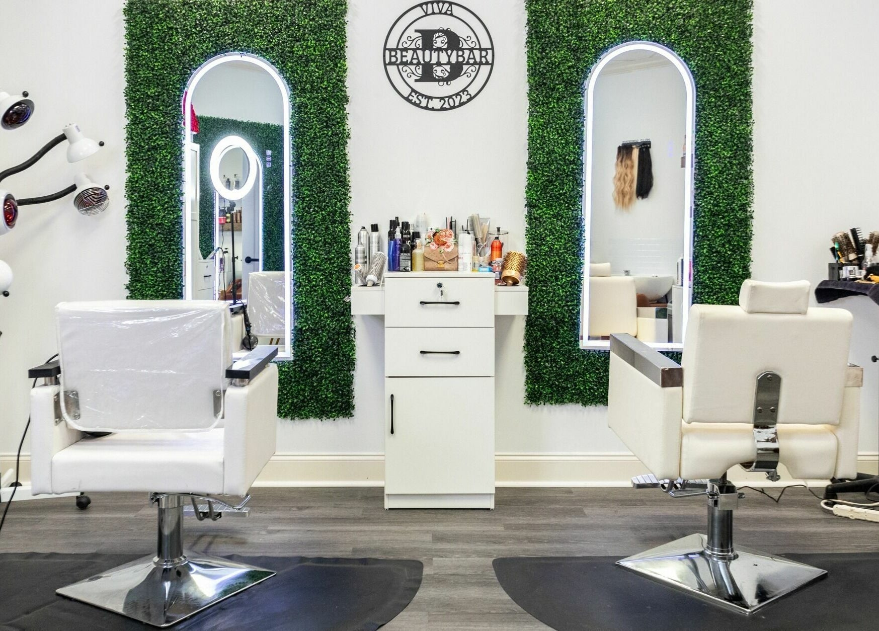 Modern salon interior at Viva Beauty Bar Via Maks Salon in Cumming, Georgia, US with stylish chairs and mirrors.