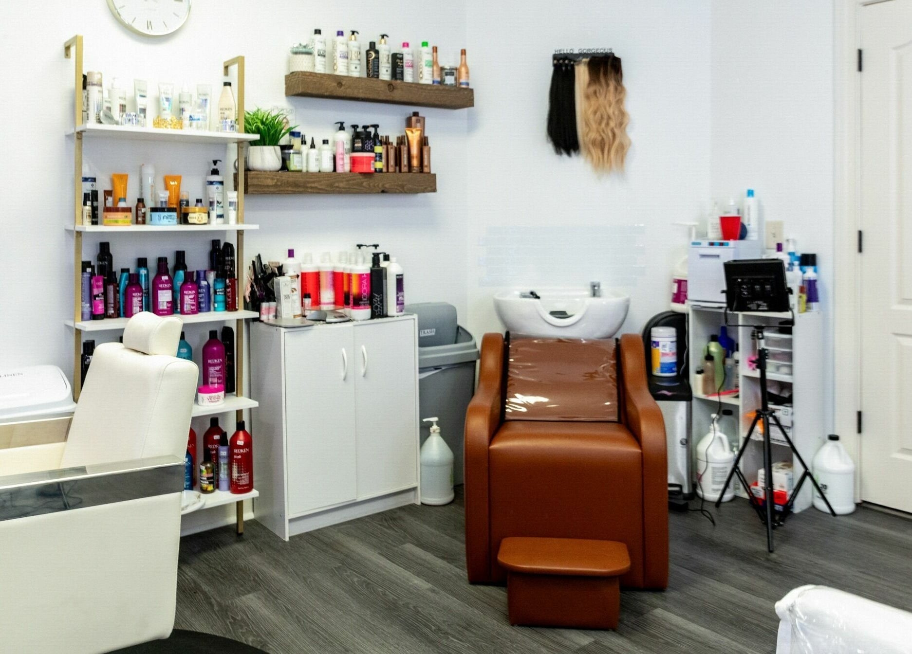 Modern hair salon setup at Viva Beauty Bar Via Maks Salon, Cumming, Georgia, US showcasing various hair products.