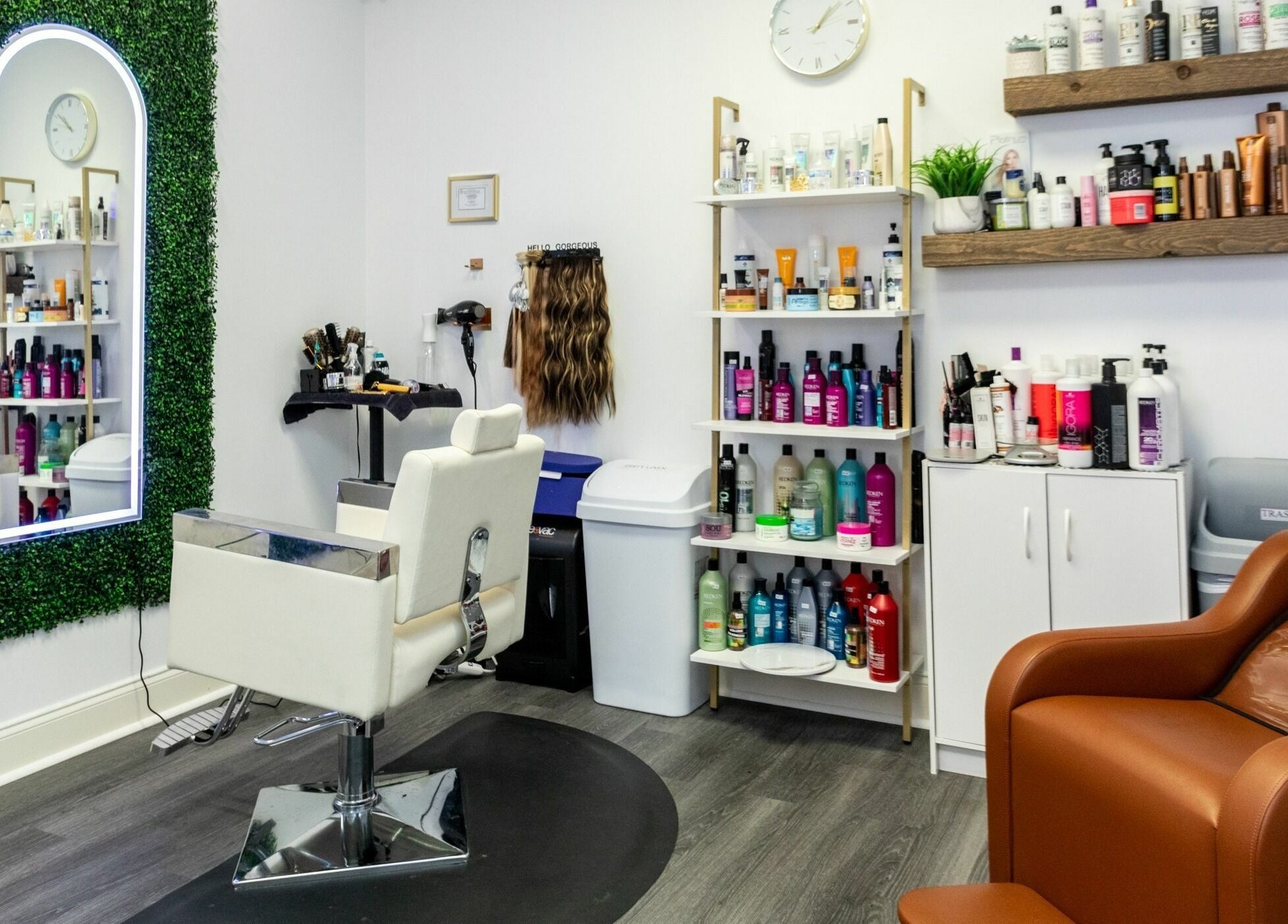 Stylish salon interior at Viva Beauty Bar Via Maks Salon in Cumming, Georgia, US with shelves of hair products.