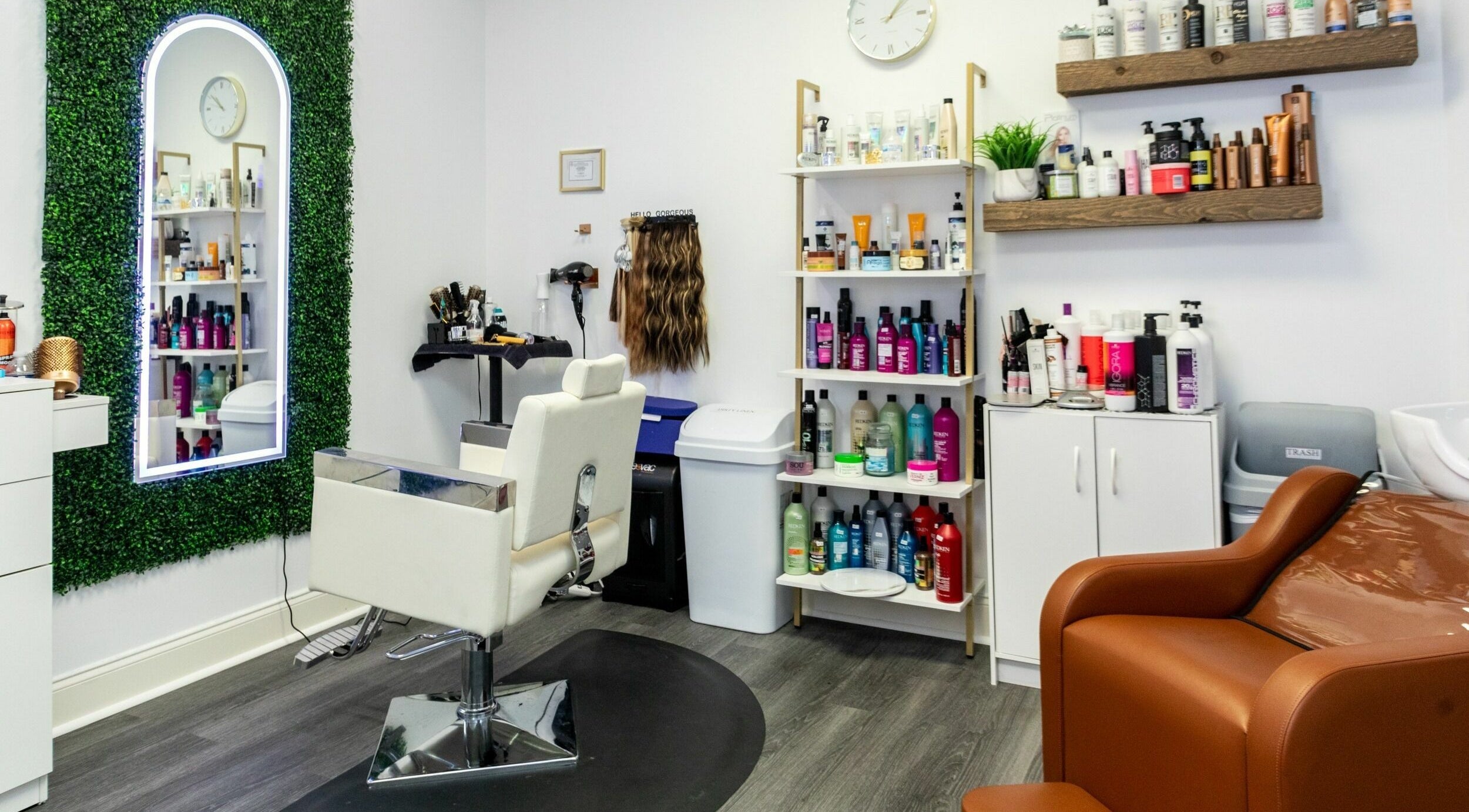 Stylish salon interior at Viva Beauty Bar Via Maks Salon in Cumming, Georgia, US with shelves of hair products.