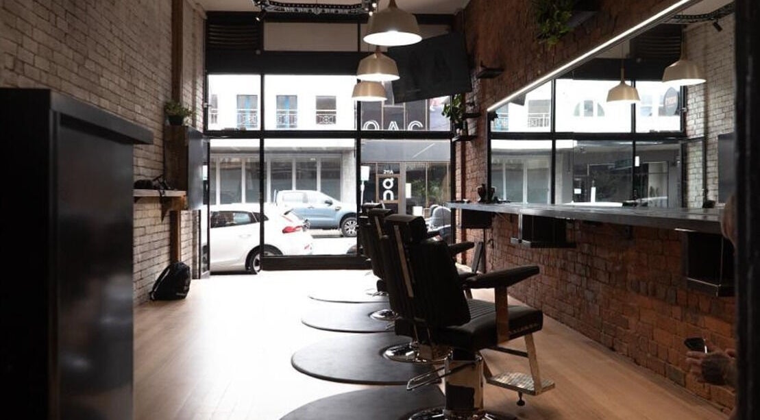 Stylish salon view at The Conductor Richmond, Richmond, VIC, AU with barber chairs and modern decor.