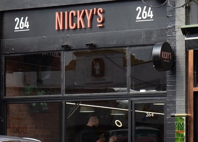 Exterior of Nicky's barbershop near The Conductor Richmond in Richmond, VIC, AU showcasing modern signage.