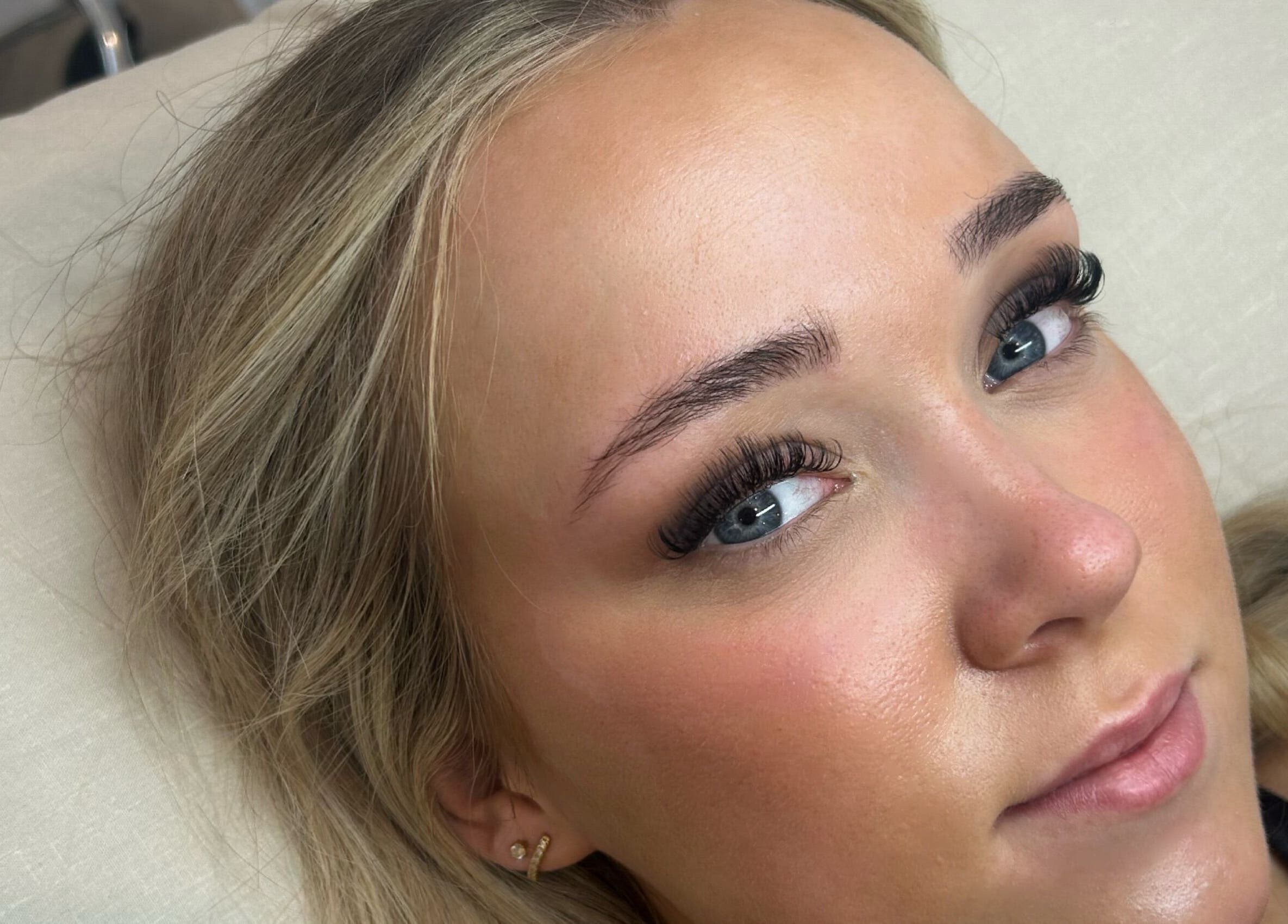 Close-up of a woman with elegant eyelash extensions at Lashed by Her, Telford, England, GB, showcasing expert beauty.