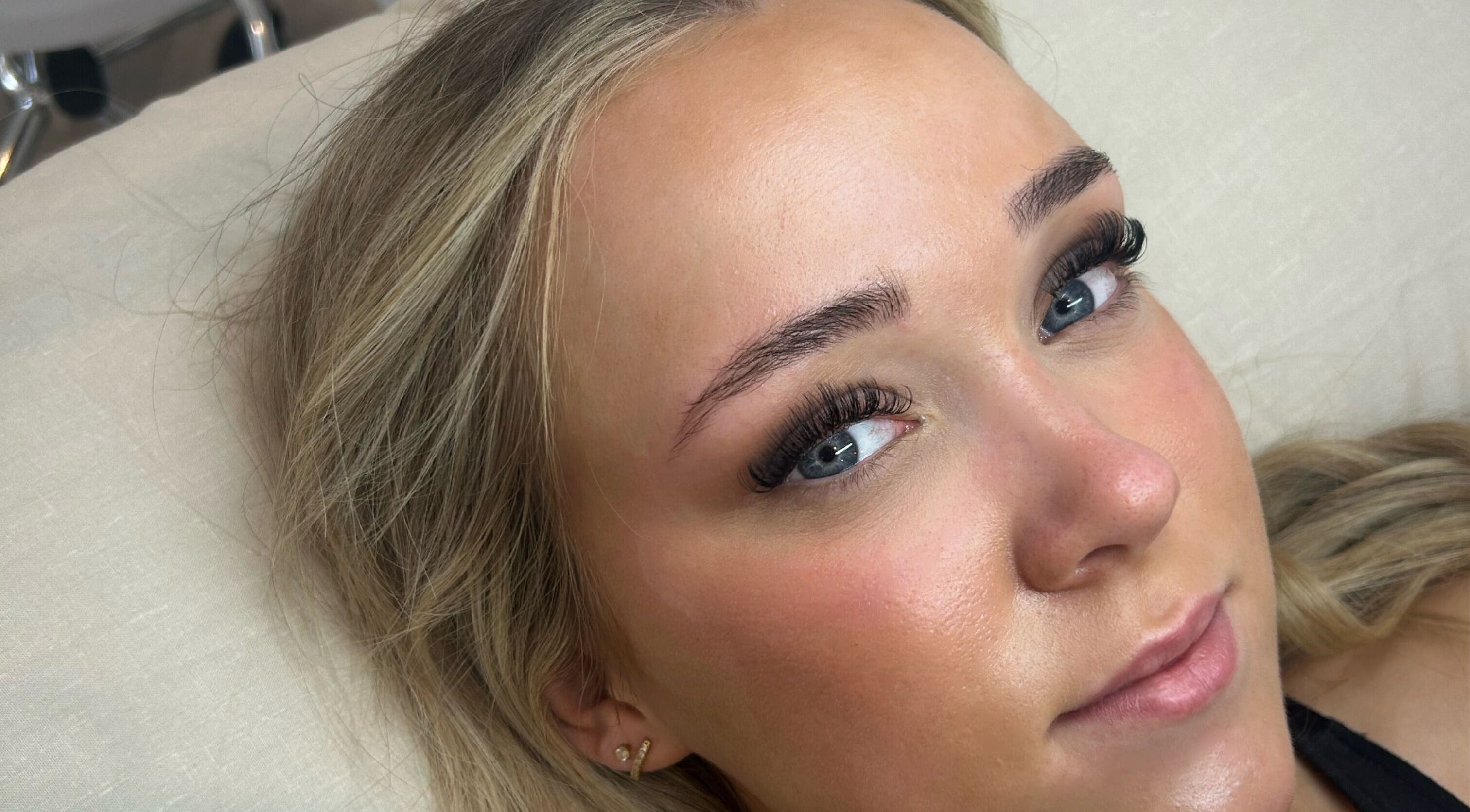 Close-up of a woman with elegant eyelash extensions at Lashed by Her, Telford, England, GB, showcasing expert beauty.