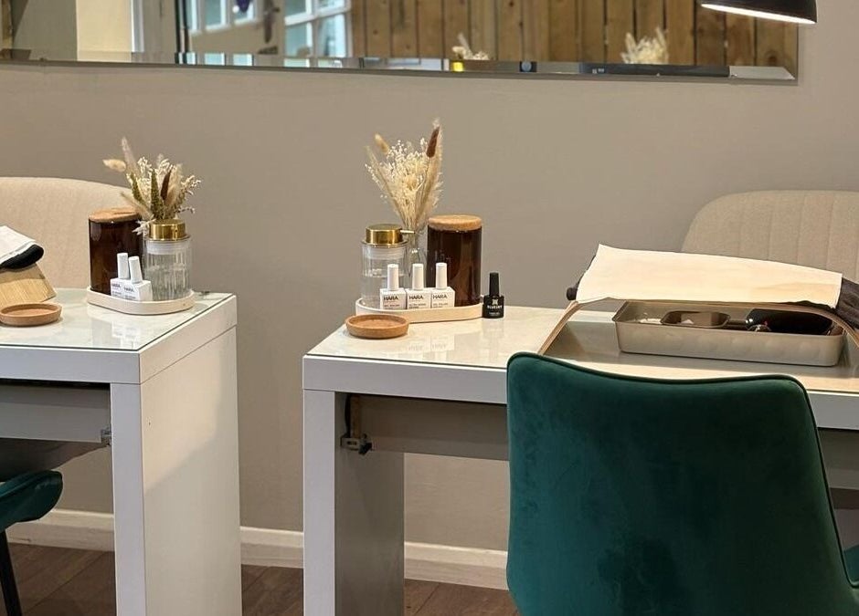 Modern nail treatment stations at Harringtons Devizes in Devizes, GB, showcasing sleek design and decor.