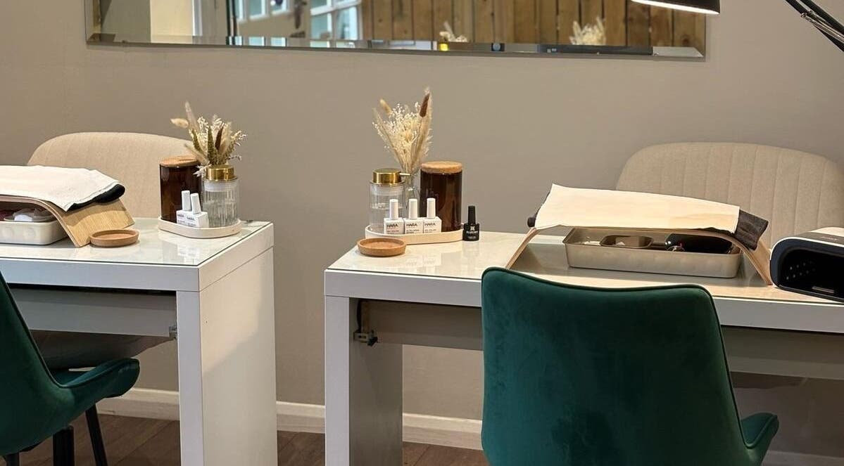 Modern nail treatment stations at Harringtons Devizes in Devizes, GB, showcasing sleek design and decor.
