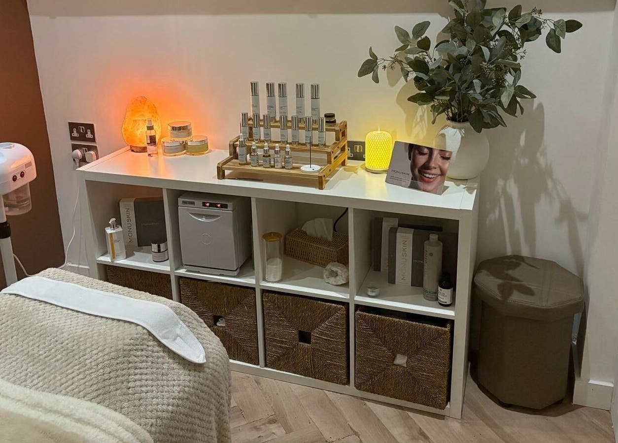 Inviting treatment area at Harringtons Devizes in Devizes, GB, featuring cozy linens and skincare products.