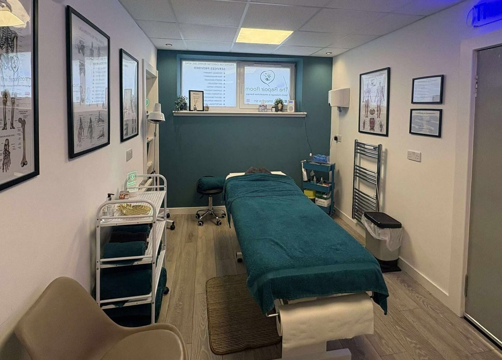 Relaxing therapy room at The Repair Room, Arbroath, Scotland, GB featuring a massage bed and soothing decor.