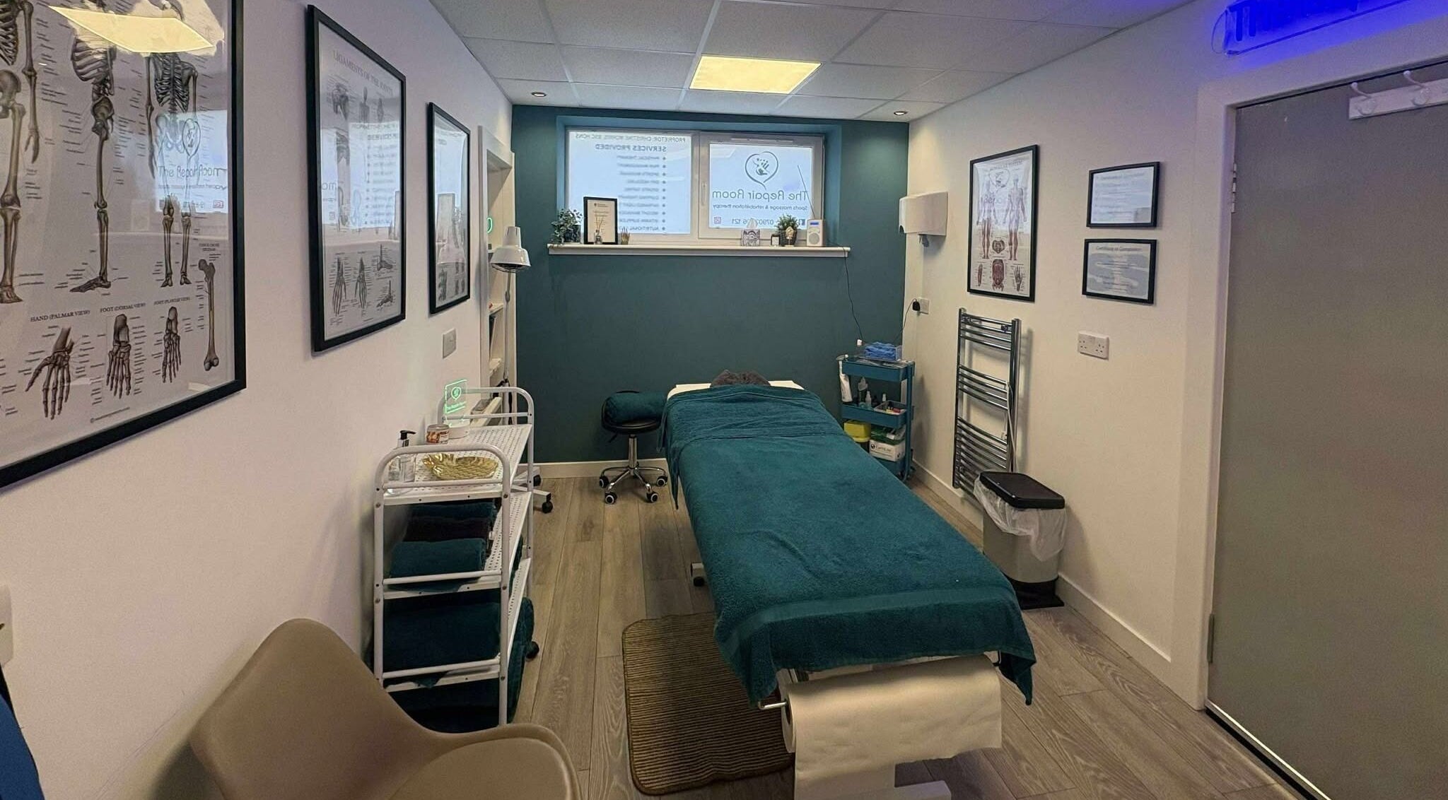 Relaxing therapy room at The Repair Room, Arbroath, Scotland, GB featuring a massage bed and soothing decor.