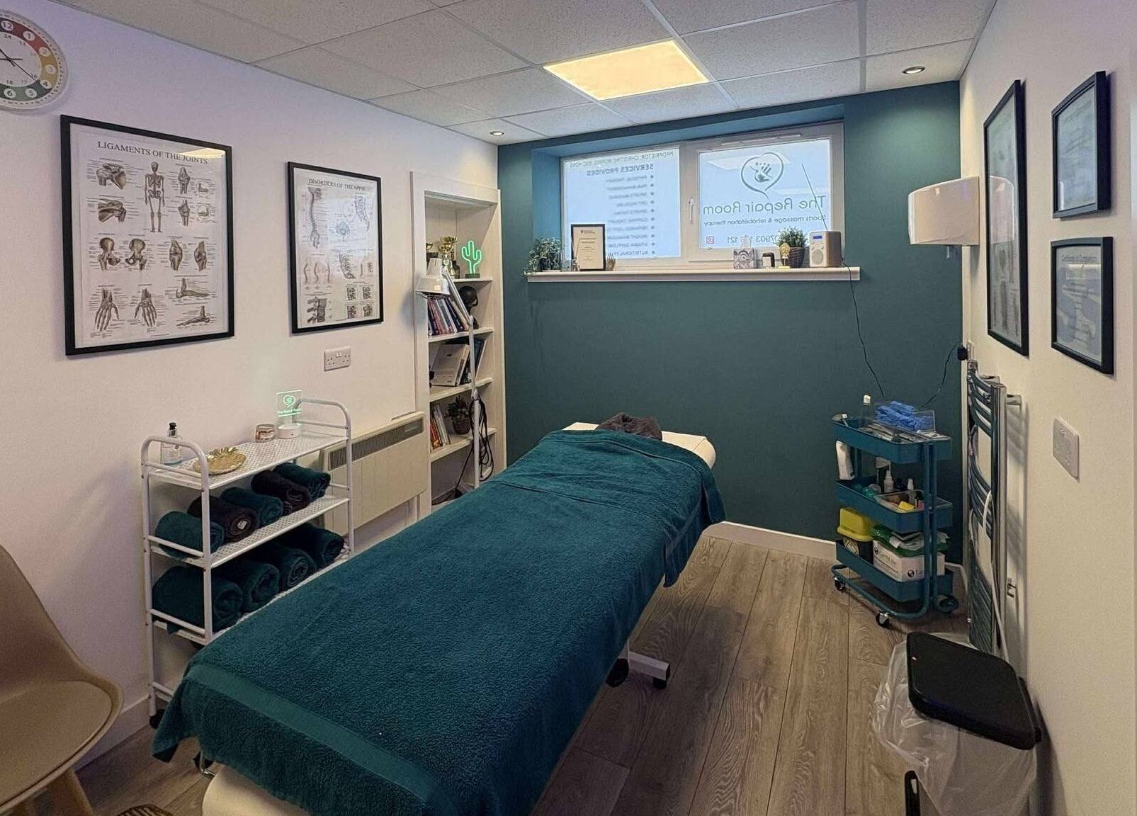 Tranquil therapy space at The Repair Room in Arbroath, Scotland, GB with massage table and decor.