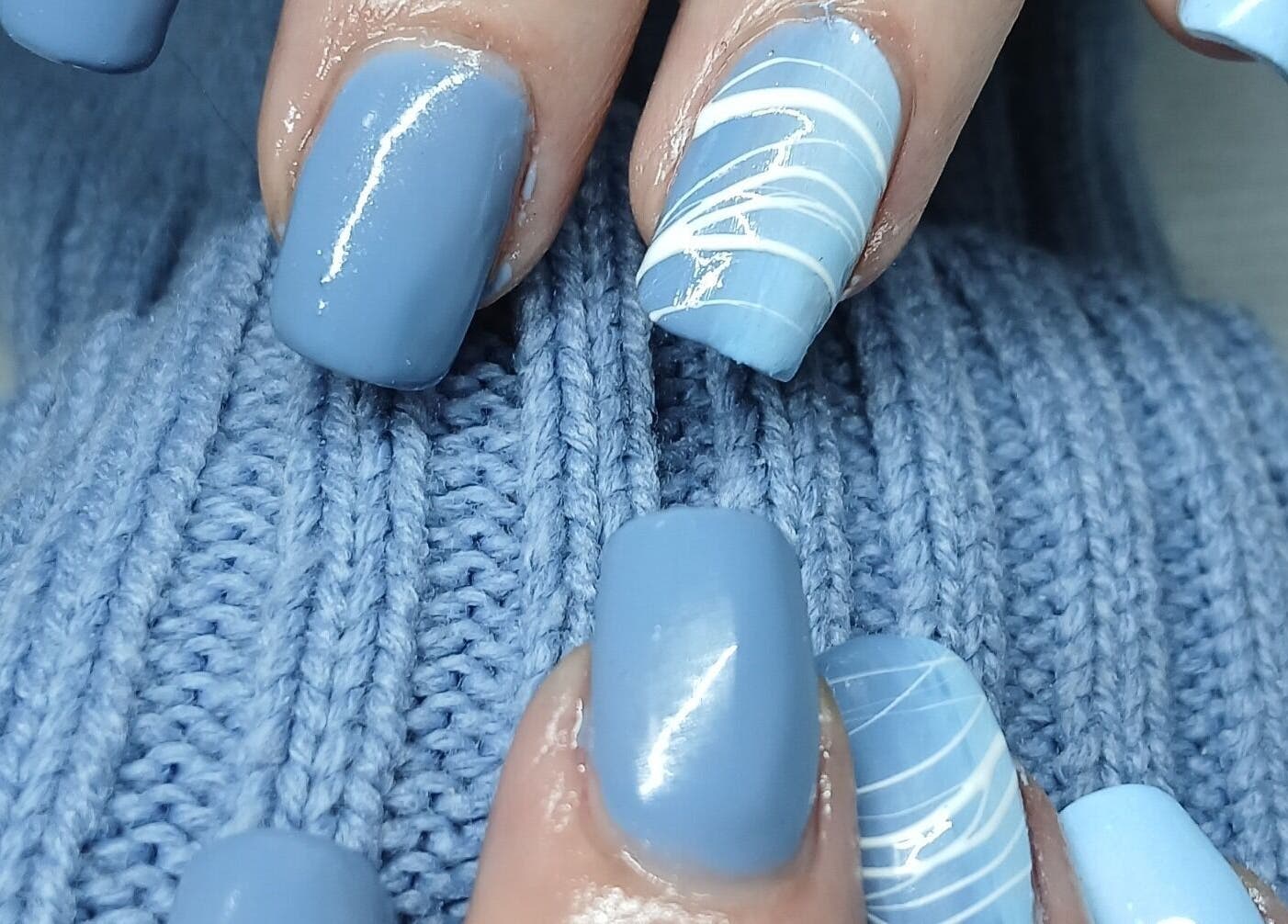Elegant blue nails with white designs by Nails by Karen, Cape Town, Western Cape, ZA.
