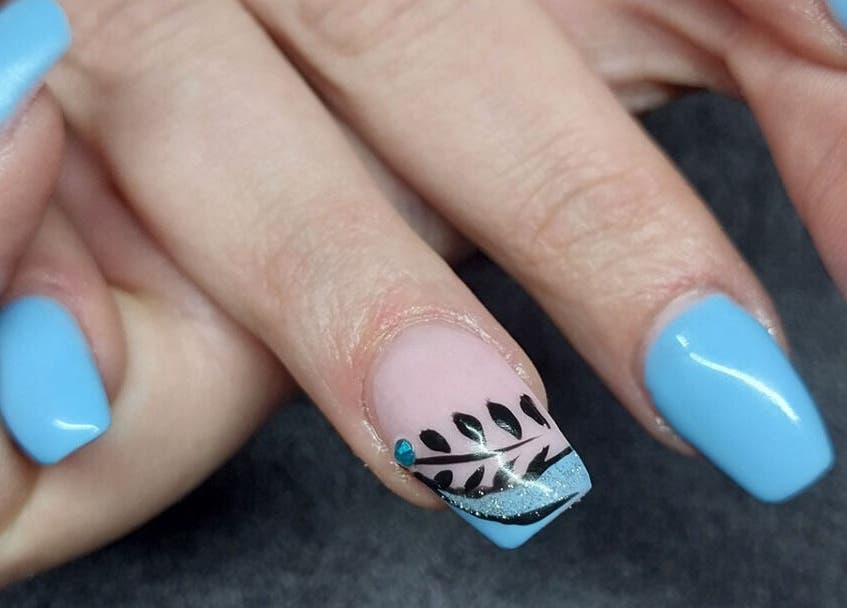 Blue nail design at Nails by Karen, Cape Town, Western Cape, ZA, featuring black leaf patterns.