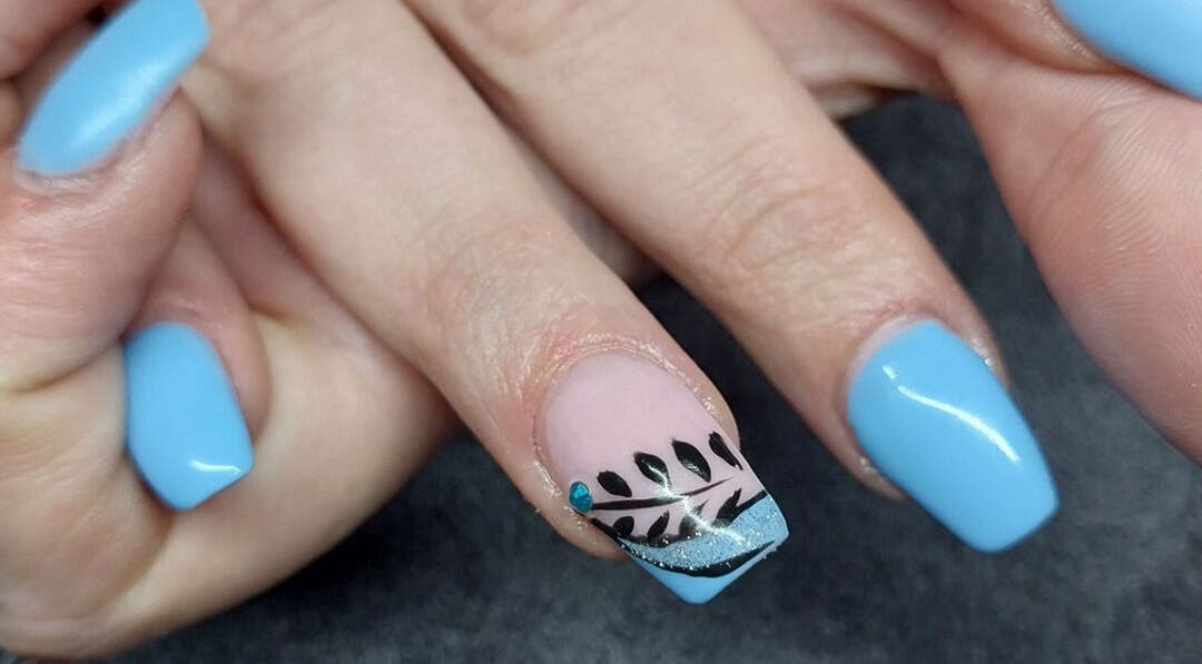 Blue nail design at Nails by Karen, Cape Town, Western Cape, ZA, featuring black leaf patterns.