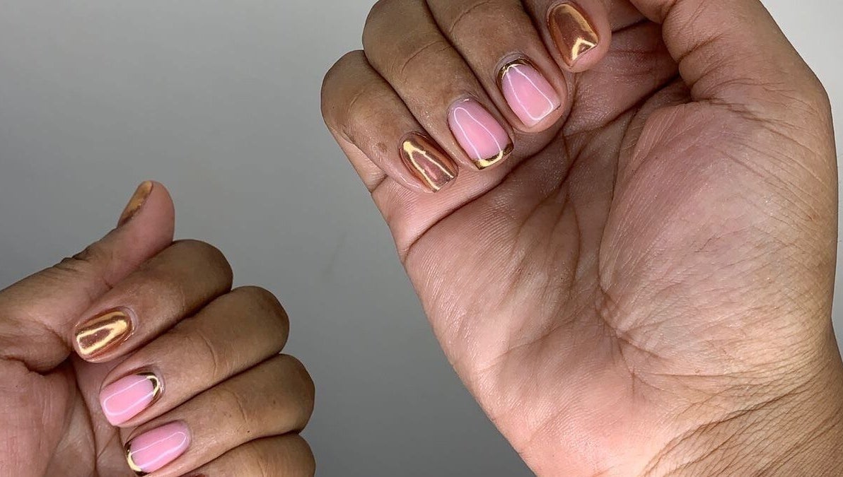 Metallic nail art at GelJunkiess & Co., Portmore, JM enhances elegant manicures.