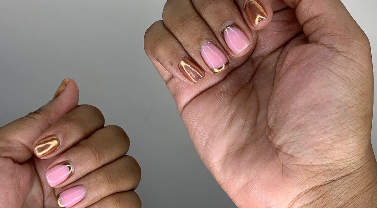 Metallic nail art at GelJunkiess & Co., Portmore, JM enhances elegant manicures.