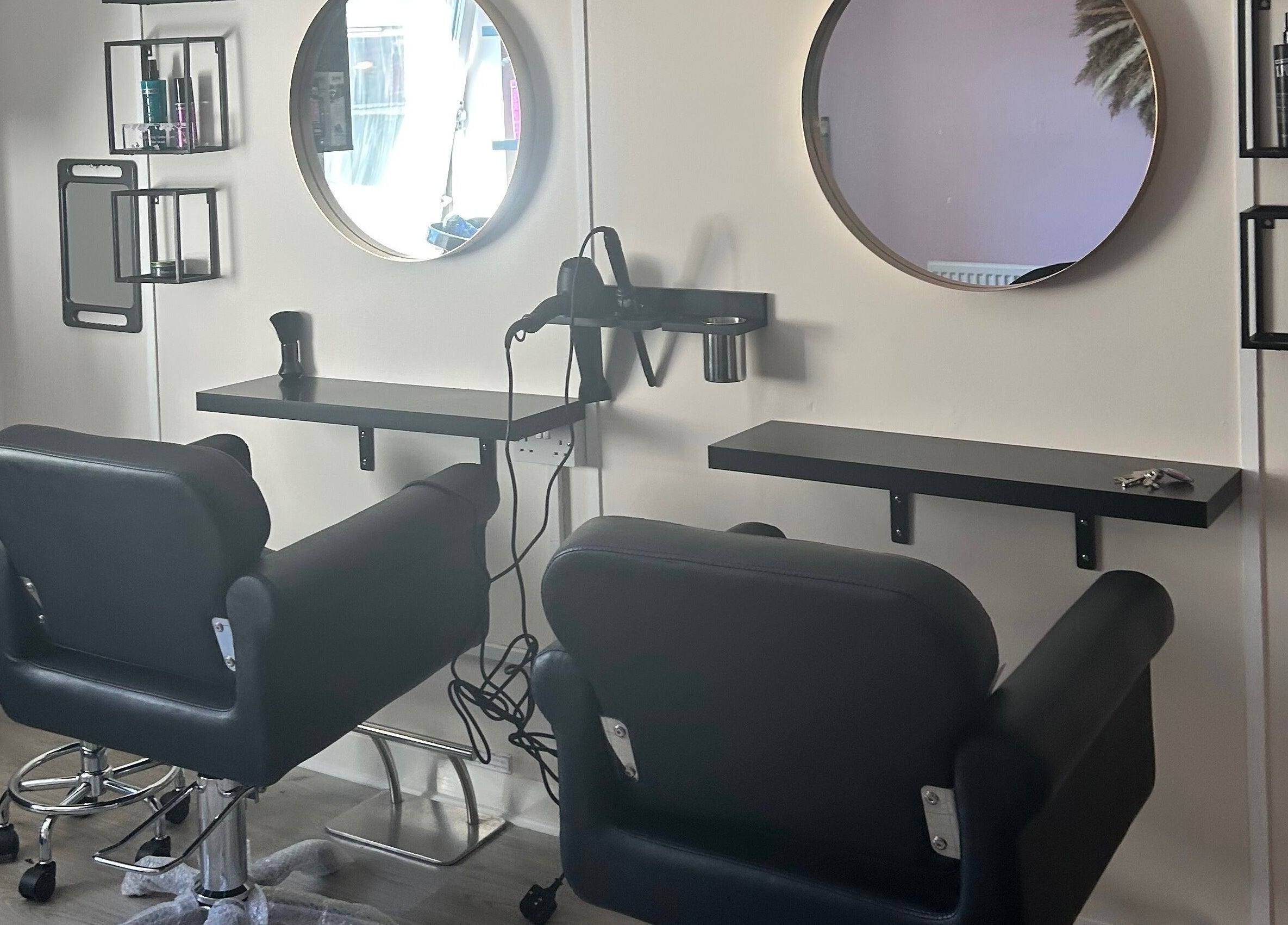 Modern salon stations at Locks of Love Hair by Claire, Paisley, Scotland, GB. Sleek design for premium hair care.