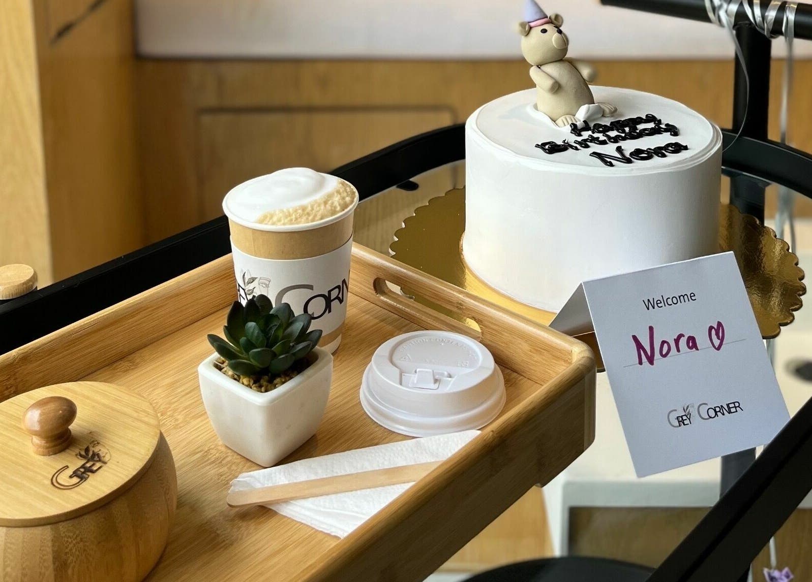 Welcome display with cake and coffee at Grey Corner Salon, Al Mubarraz, Eastern Province, SA.