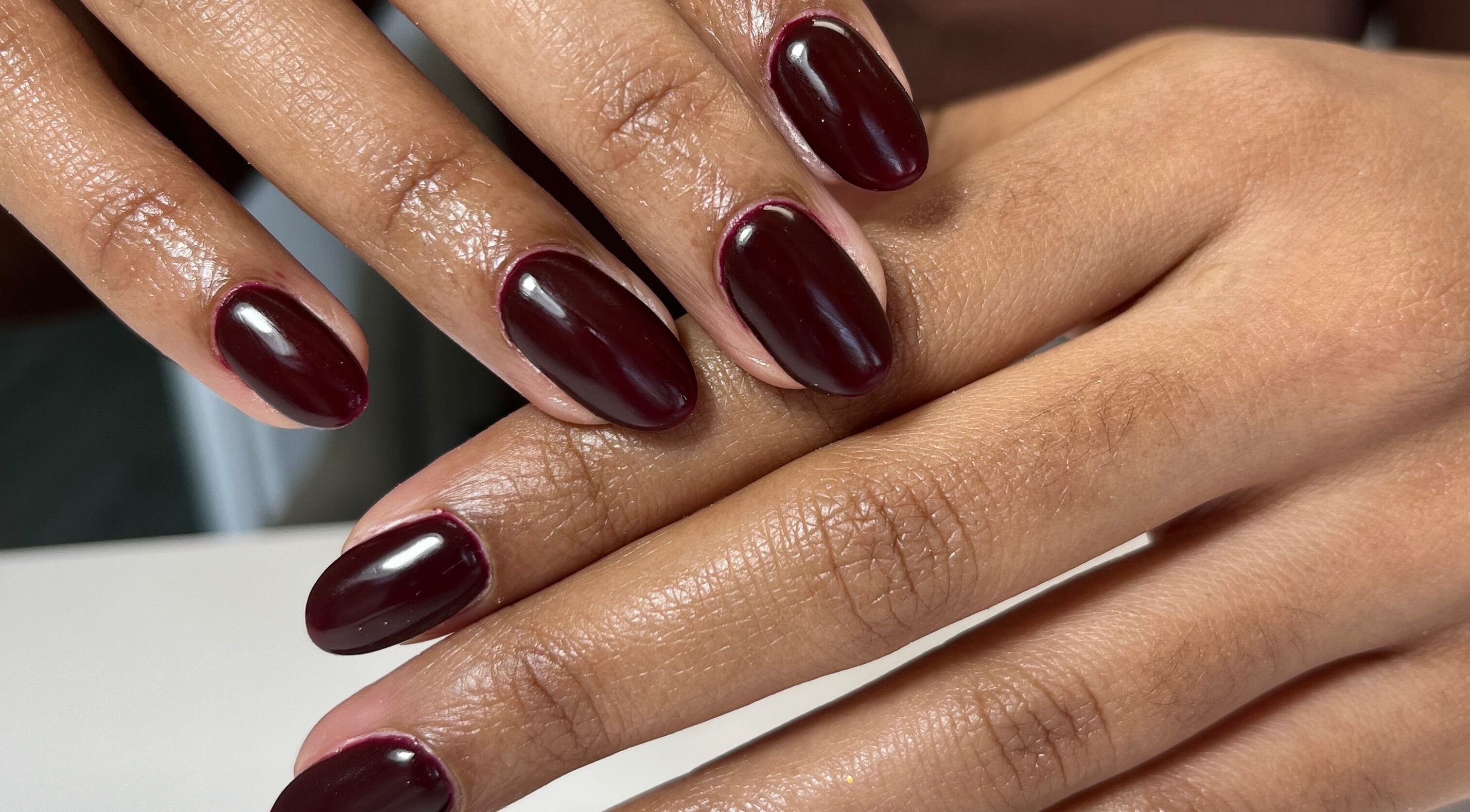Beautiful burgundy manicure at Beyond Beauty in Amanzimtoti, Kwazulu-natal, ZA. Experience elegance and style.