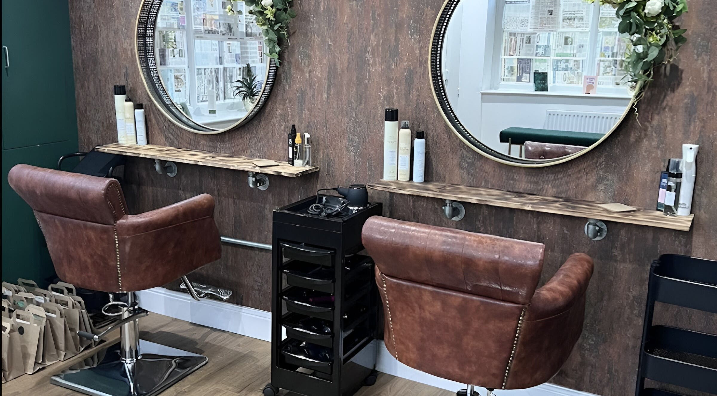Unhidden salon interior with stylish chairs and decor in Ossett, England, GB, showcasing a rustic chic vibe.