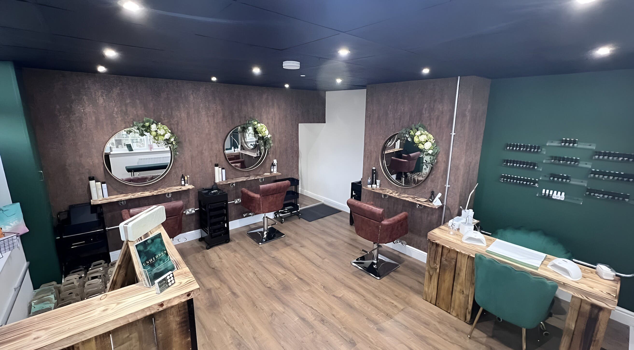 Modern beauty salon Unhidden in Ossett, England, GB, featuring elegant seating and mirrors.
