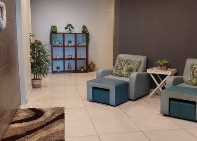 Relaxing seating area at Orchard Day Spa @ North Beach Durban, Durban, Kwazulu-natal, ZA with green decor.