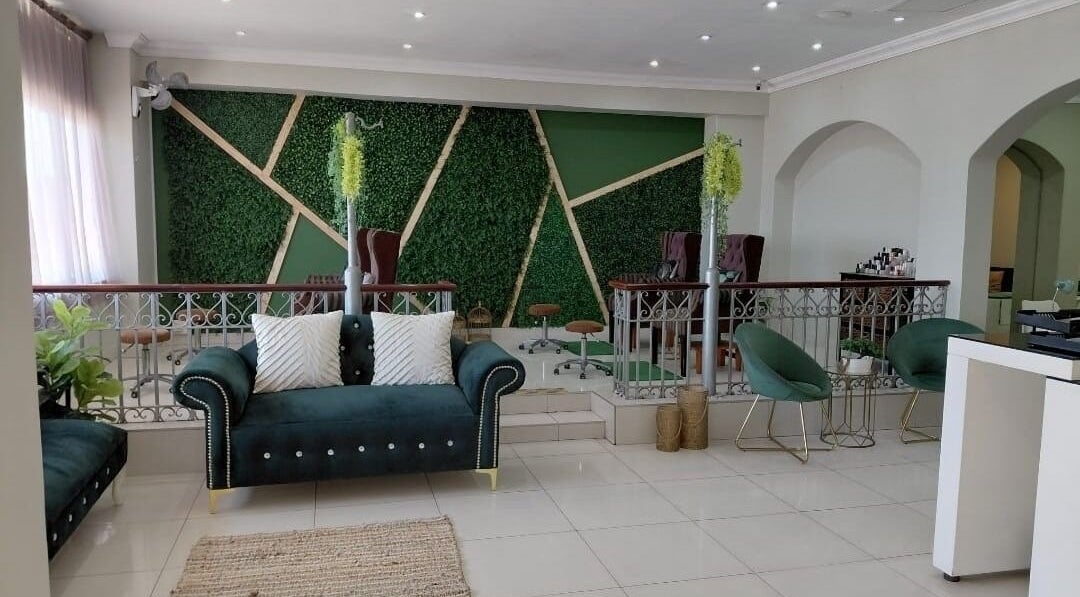Elegant seating area at Orchard Day Spa @ North Beach Durban, featuring lush green walls. Durban, Kwazulu-natal, ZA.