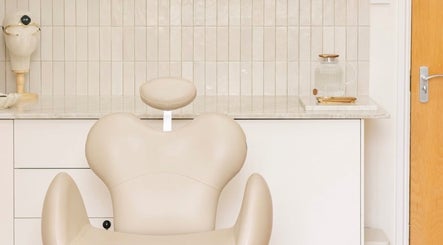 Relaxing cream salon chair in UNFLTRD Beauty, Waltham Abbey, England, GB, perfect for tranquil beauty experiences.