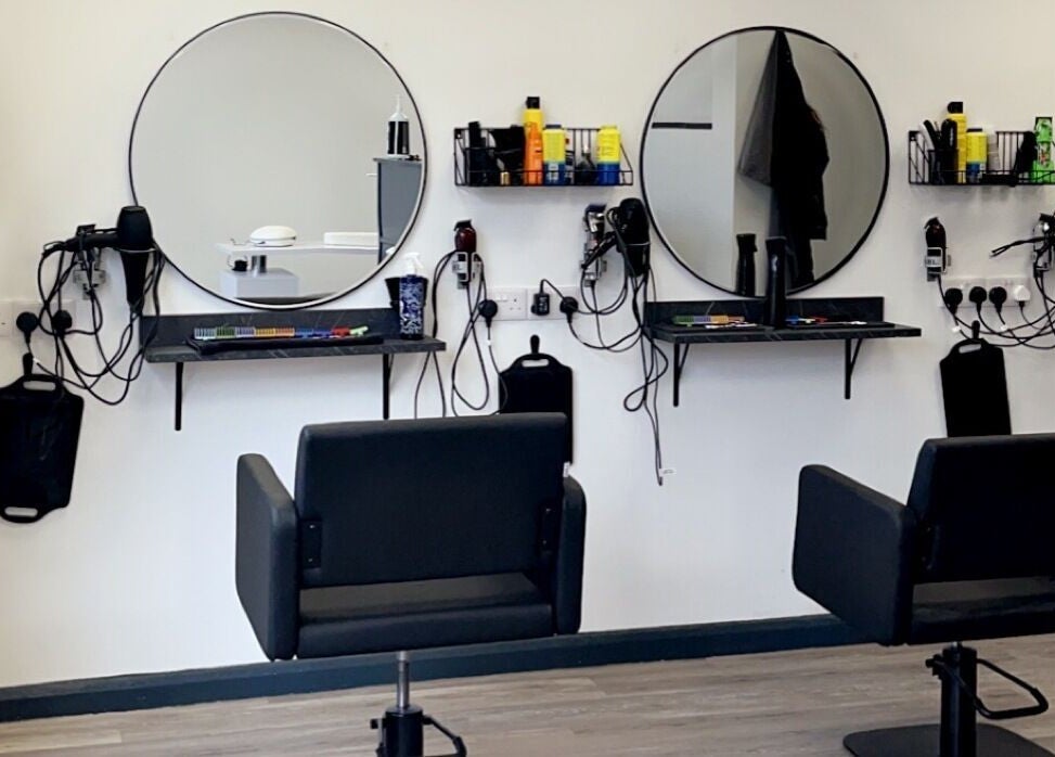 Contemporary salon chairs and round mirrors at Kutz Salon, Lincoln, England, GB.
