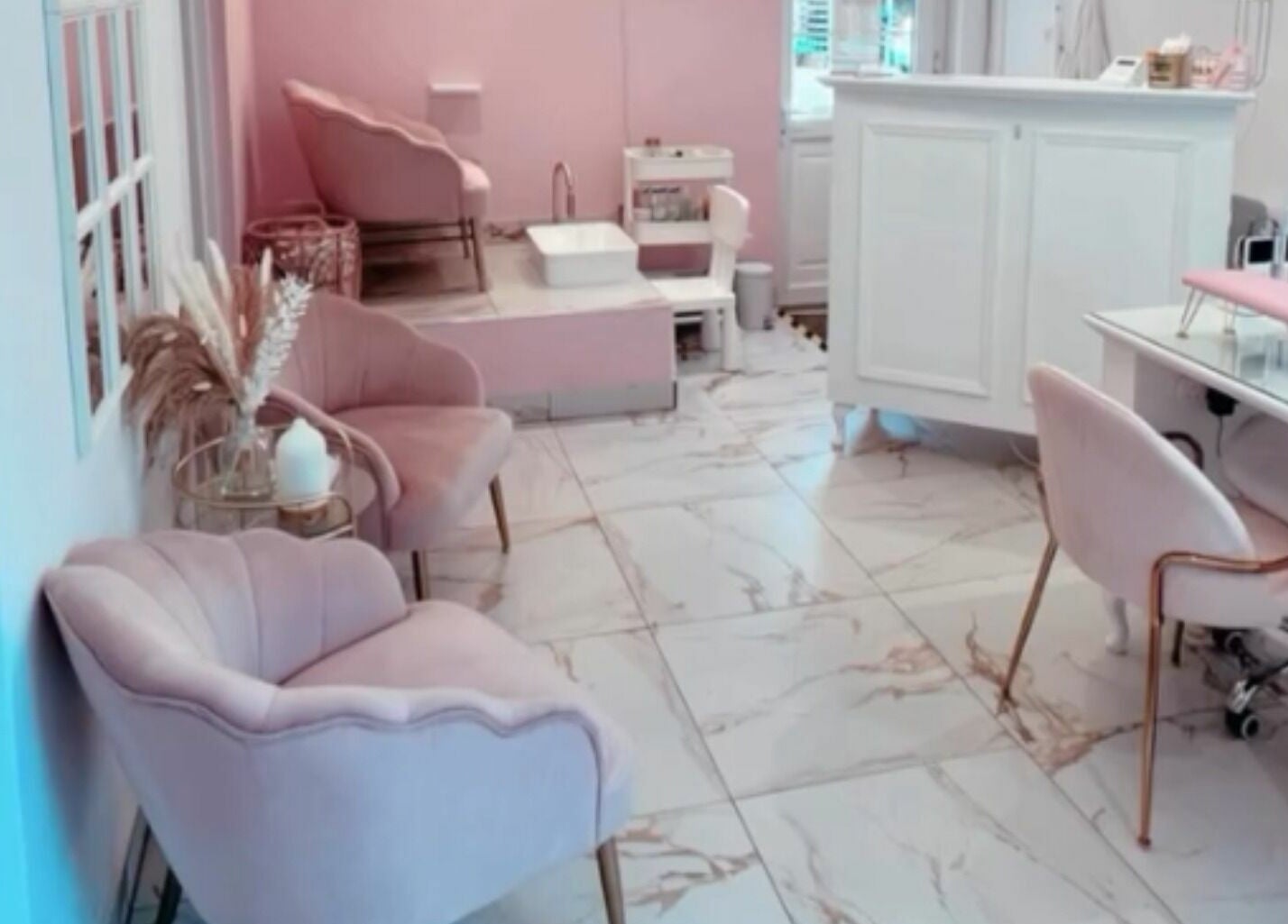 Chic interior of The Salon by Jasmine in West Haddon, England, GB featuring plush seating and modern decor.