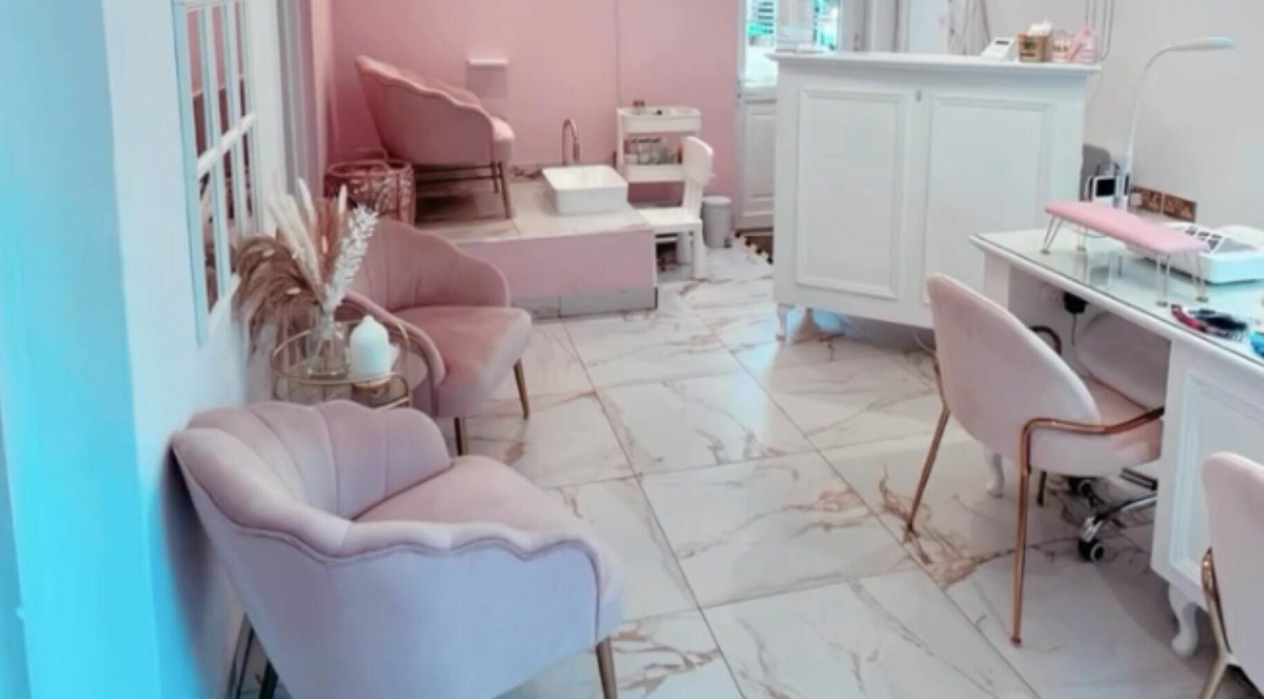 Chic interior of The Salon by Jasmine in West Haddon, England, GB featuring plush seating and modern decor.