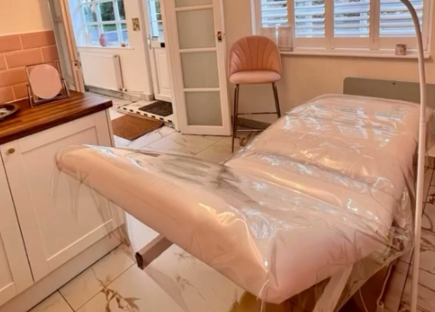 Relaxing treatment room at The Salon by Jasmine, West Haddon, England. Cozy setting for beauty and wellness.
