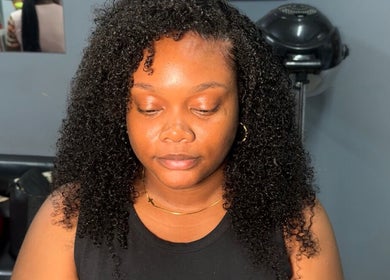 Woman with styled curly hair at Millennial Beauty Tribe, Kingston, St. Andrew Parish, JM.