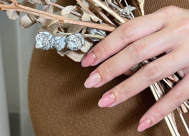 Elegant manicured nails at Nicce Luxury Beauty Ltd in Hong Kong Island, HK, showcasing pink and gold accents.