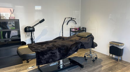 Elegant treatment room at Beauty by JM in Telford, England, GB, featuring a comfortable treatment bed.